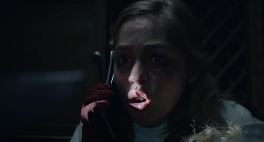 a bloodied girl on the phone in Theres Someone Inside Your House