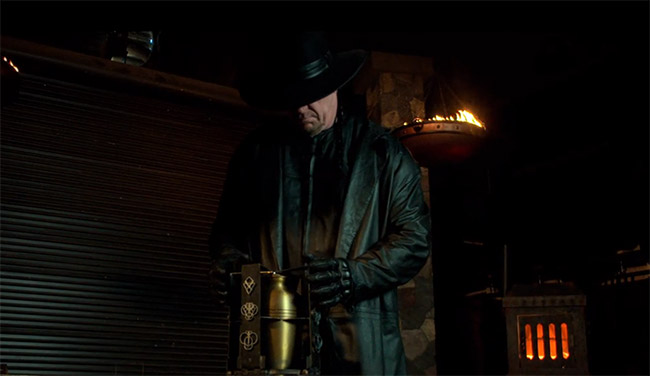 the undertaker fondles his urn